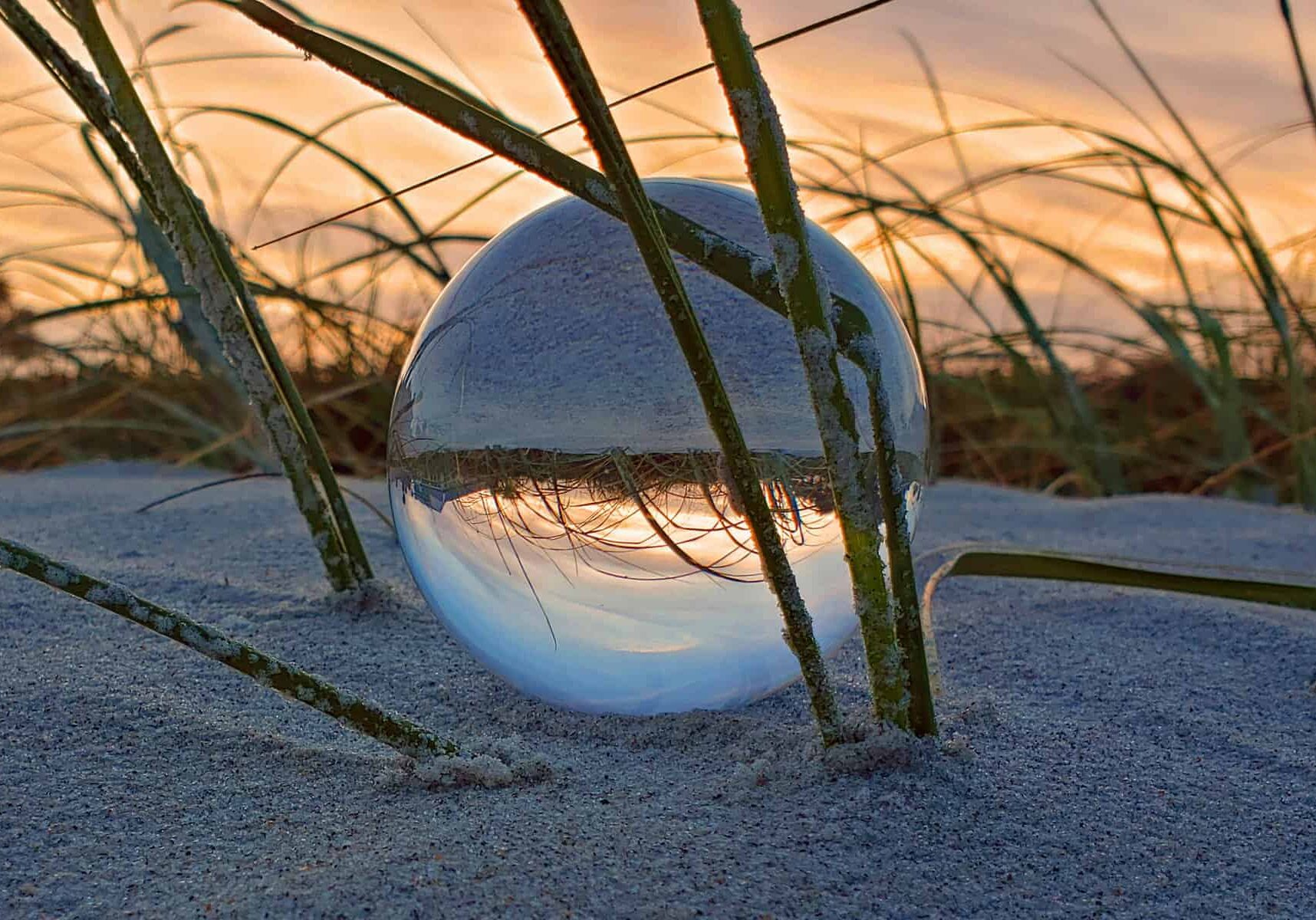 Glass Beachball in the Dune, by Ted Floore